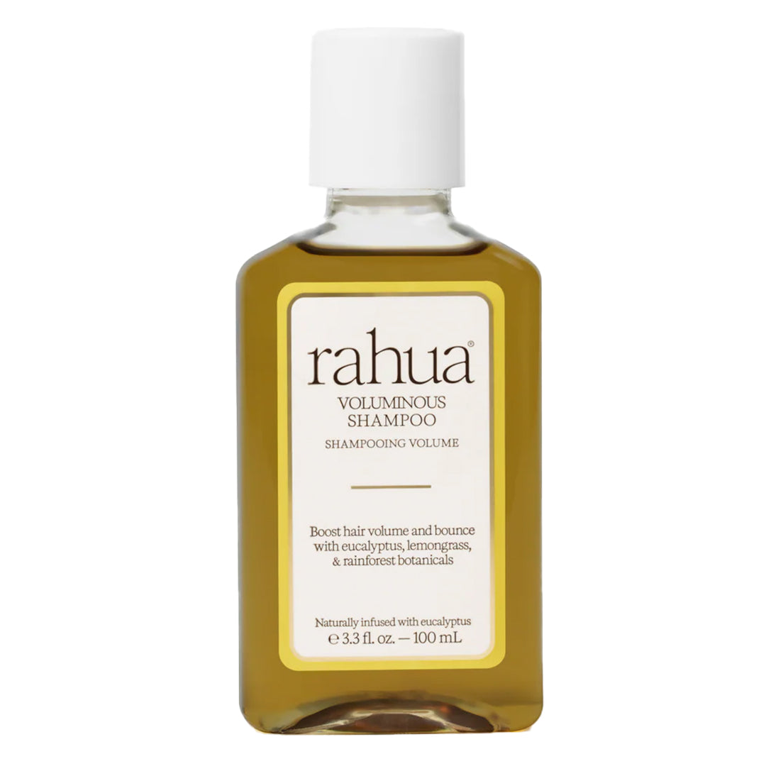 Rahua | Voluminous Shampoo 100 ml | Product Image - clear bottle filled with golden olive-colored shampoo and a white cap on a white background