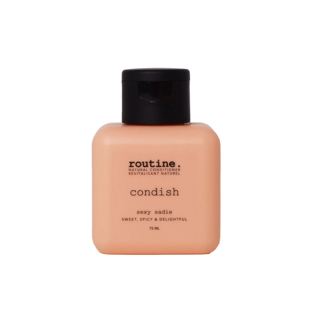 Routine | Conditioner Travel Mini - Sexy Sadie | Product Image - peach bottle with black cap on a white background