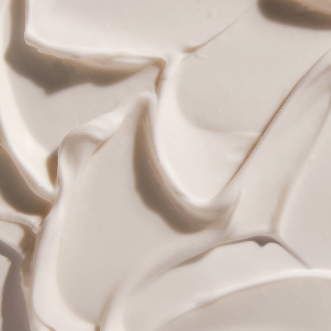 Sahajan | Restorative Sleep Mask | Texture Image - creamy facial mask texture spread across a surface, showing smooth swirls and soft peaks