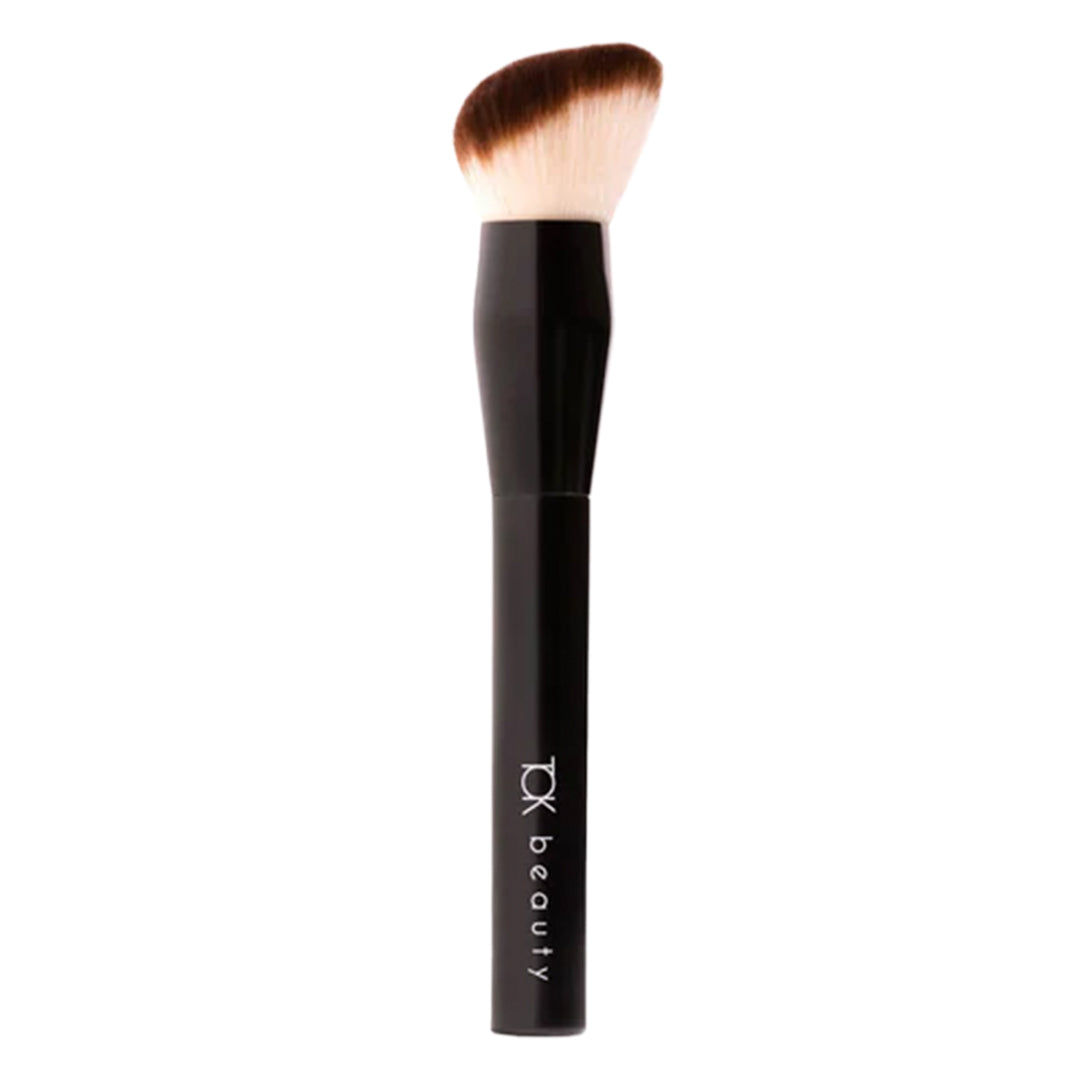 TOK Beauty | Foundation Brush | Product Image - front view of the  brush with an angled cream-and-brown bristle head and a glossy black handle on a white background