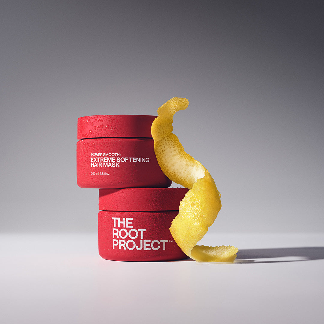The Root Project | Power Smooth Extreme Softening Hair Mask | Lifestyle Image - red jars with a curled lemon peel