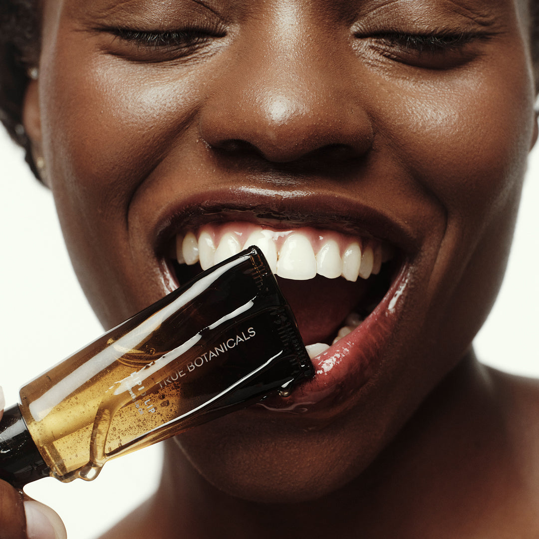 True Botanicals | Lipid Lip Hydrating Lip Oil | Model Image - close-up of lip oil showing glossy, hydrated lips