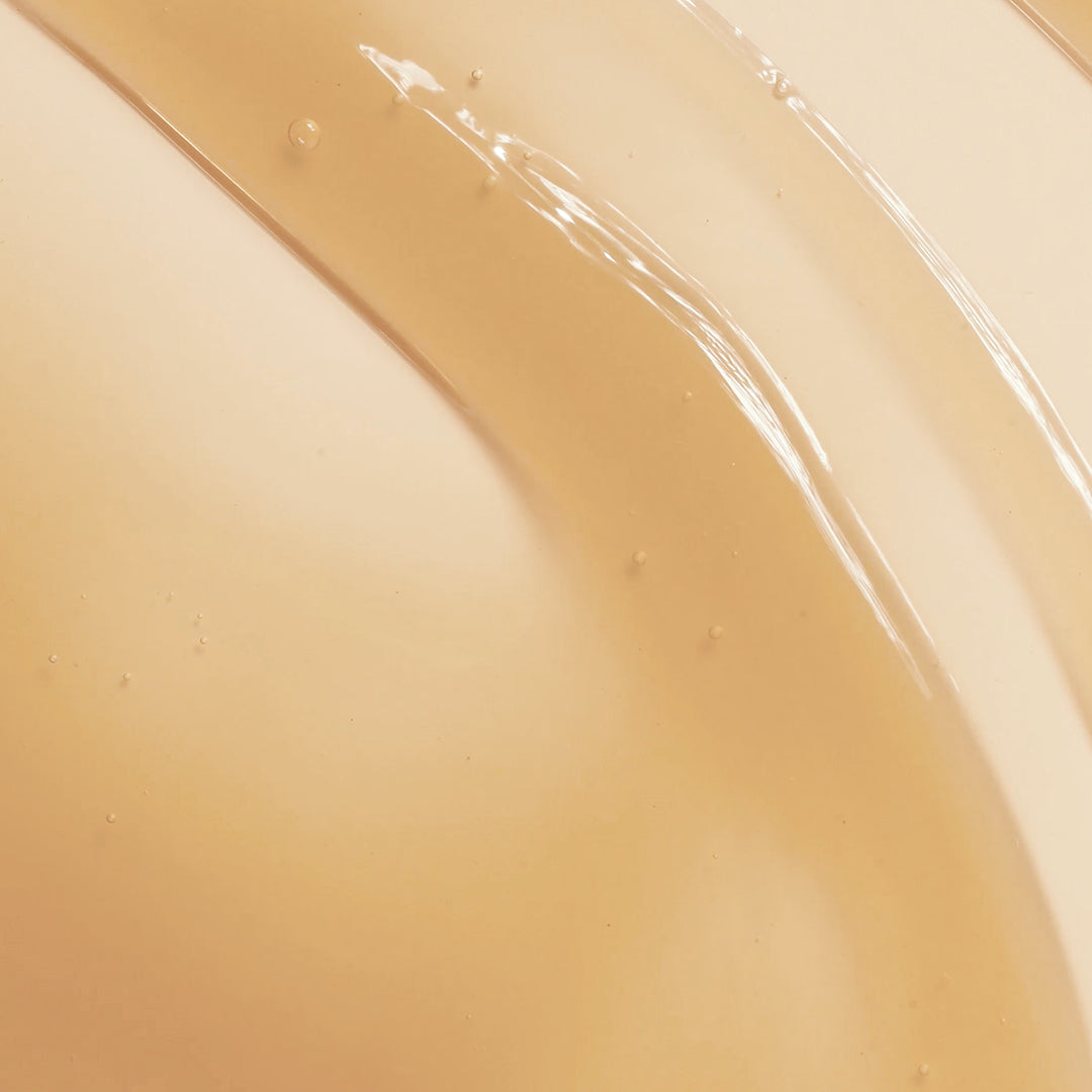 True Botanicals | Lipid Lip Hydrating Lip Oil | Swatch Image - close-up of glossy lip oil texture swatch