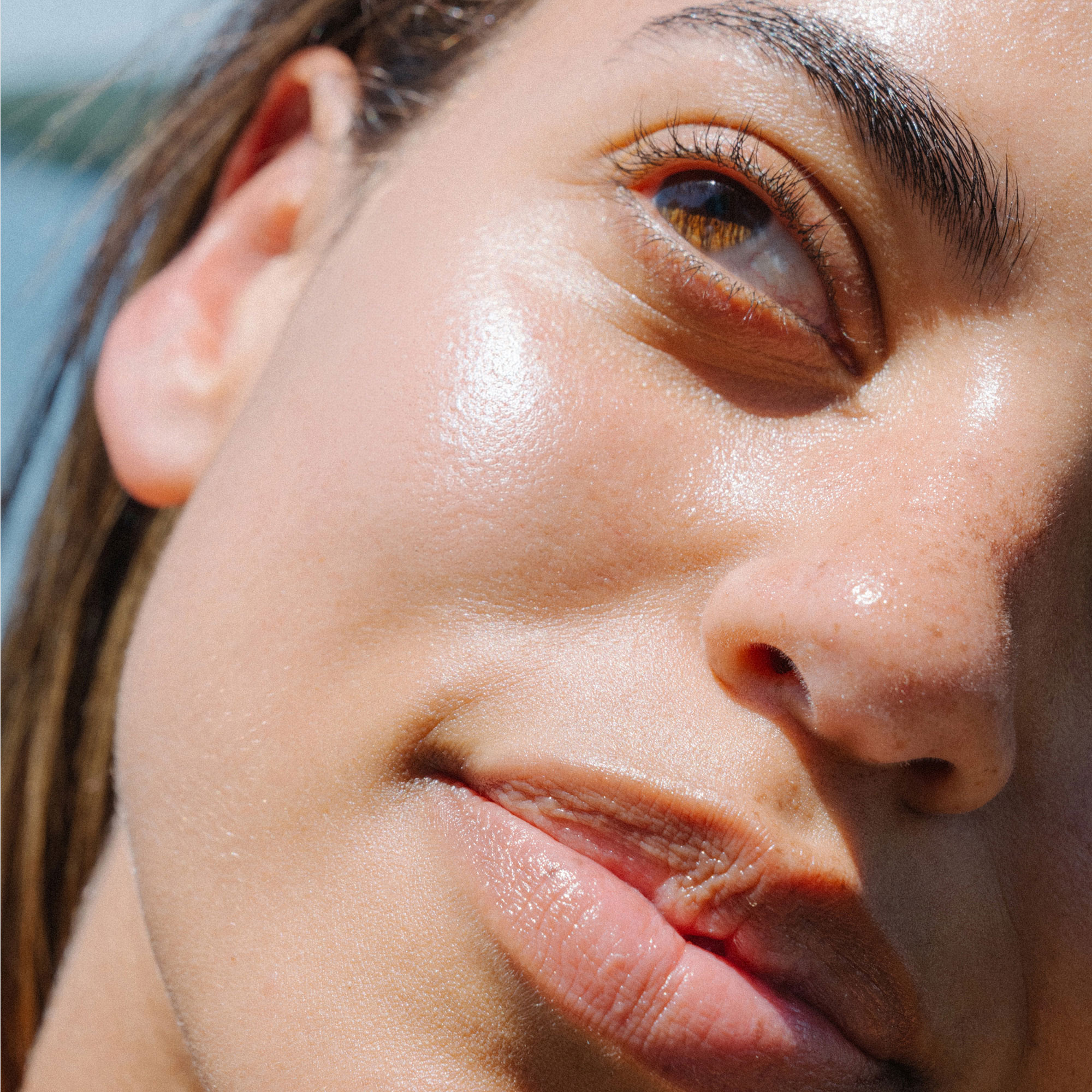 Ursa Major | Sunny Start Eye Serum | Model Image - close-up portrait of glowing skin