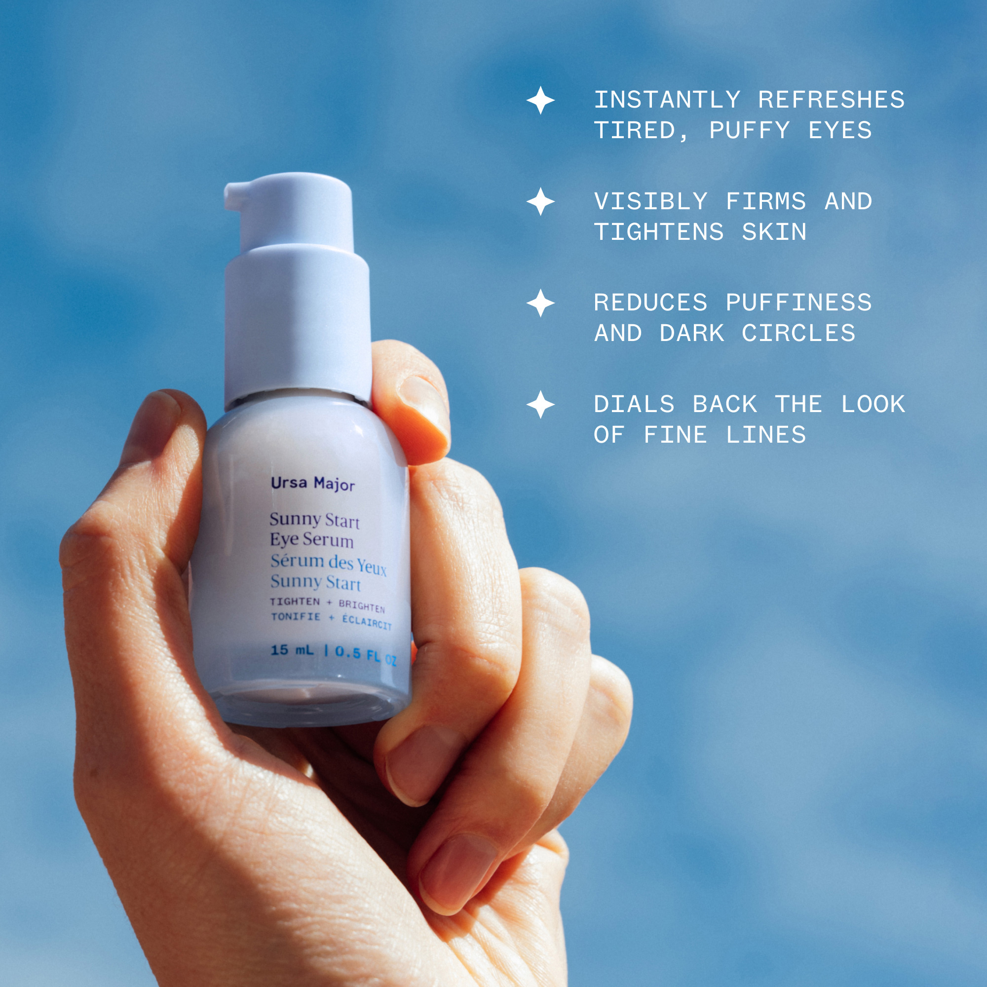 Ursa Major | Sunny Start Eye Serum | Product Image with Benefits - hand holding serum against a blue sky background with highlighted eye care benefits text
