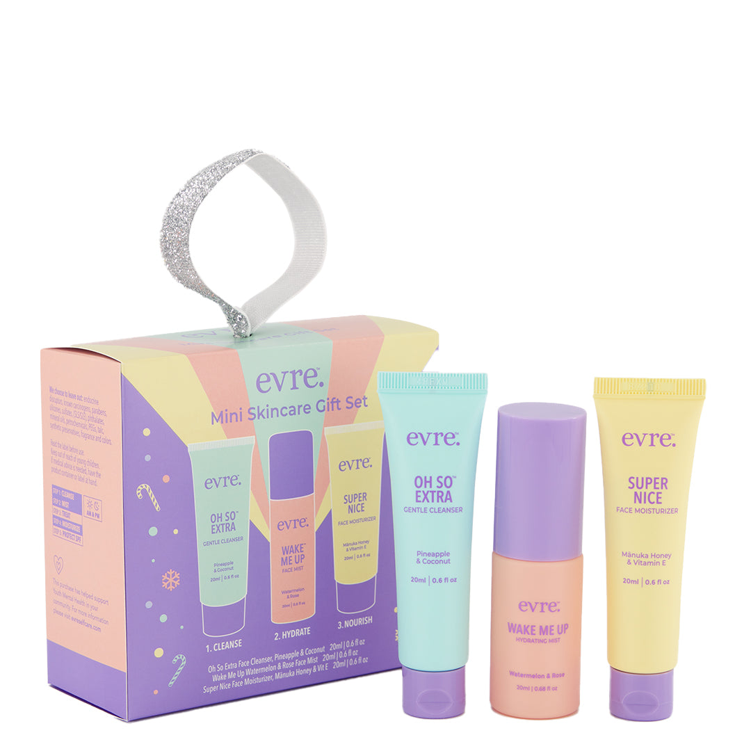 evre. | Mini Skincare Gift Set | Product Image - evre Mini Skincare Gift Set with cleanser, face mist, and moisturizer beside the holiday gift box.