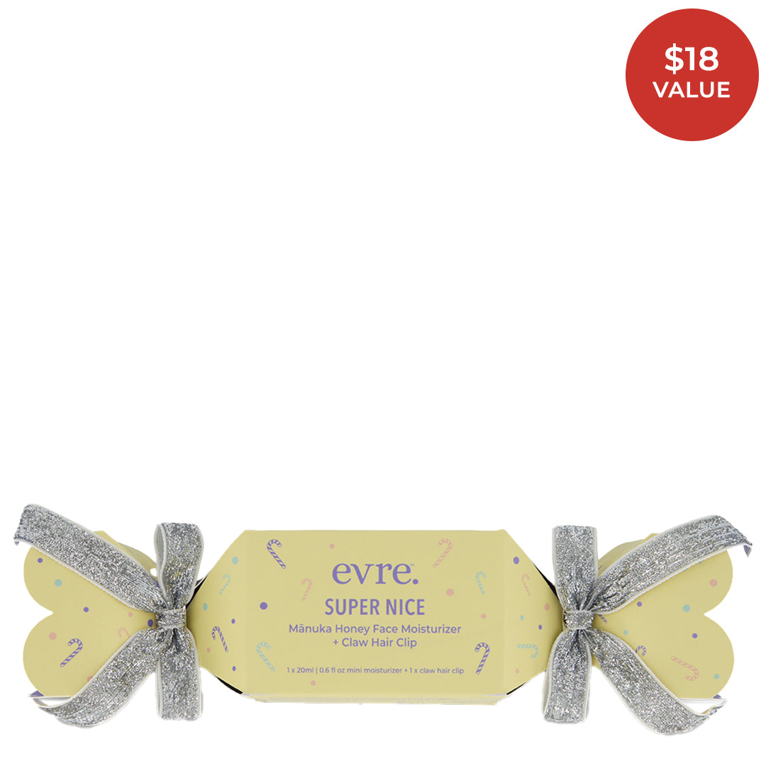 evre | Super Nice | Set Image with Red Sticker - evre Super Nice holiday cracker with Manuka Honey Face Moisturizer and purple claw hair clip.