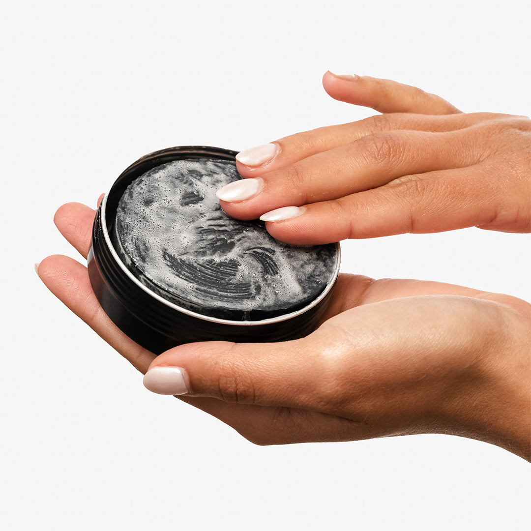 withSimplicity | Charcoal Face Bar | Lifestyle Image - hands lathering the charcoal face bar