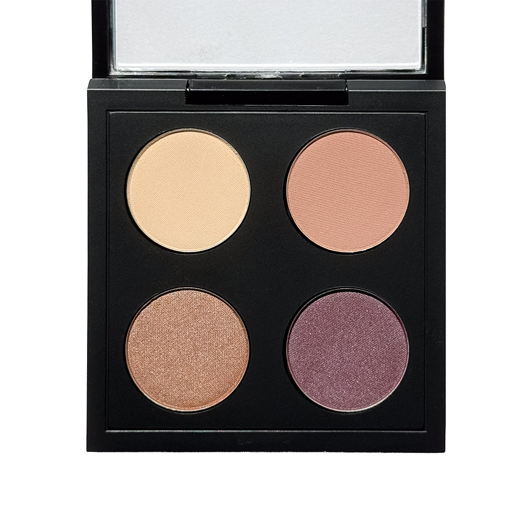 withSimplicity | Color Theory - Hazel Eye Palette | Product Image - open black eyeshadow palette featuring four shades of champagne, peach, bronze, and plum on a white background
